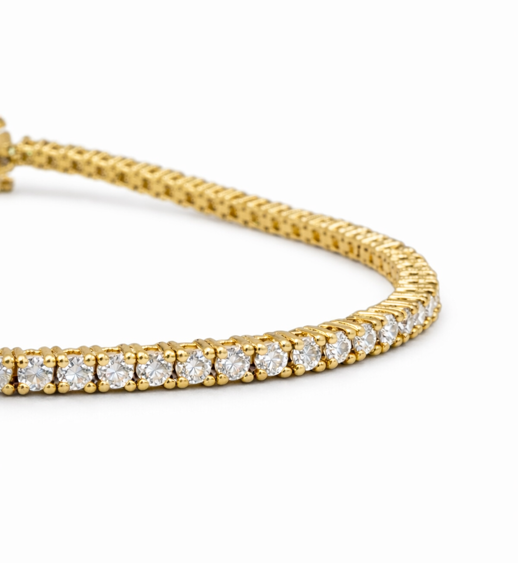 Gold Tennis bracelet with Diamonds on a white background